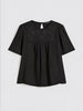 Top in tela di lino e jersey stretch